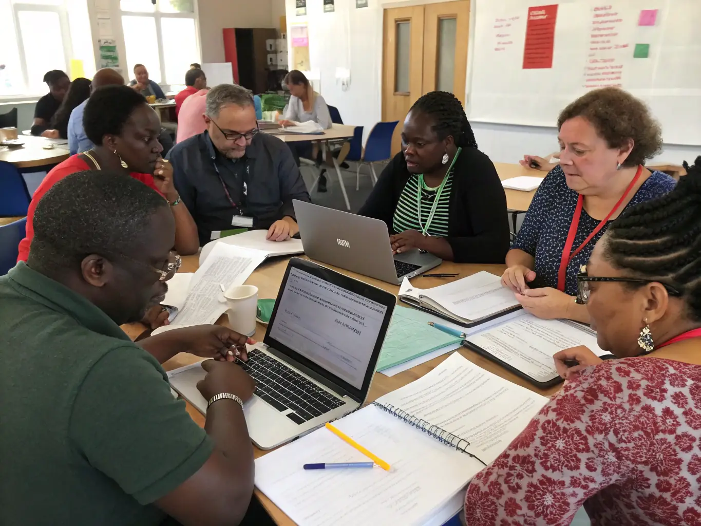 A photograph of a group of teachers actively participating in a seminar, with a facilitator leading a discussion on innovative teaching strategies.